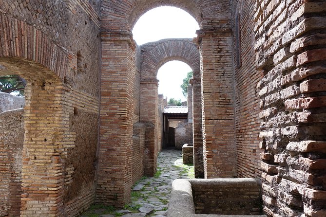 Ancient Ostia Antica Semi-Private Day Trip from Rome by Train with Guide - The 2.5-hour walk through Ostia’s main street, Decumanus Maximus