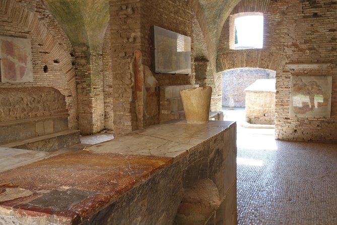 Ancient Ostia Antica Semi-Private Day Trip from Rome by Train with Guide - The amphitheater stop, what the ruins can still tell you