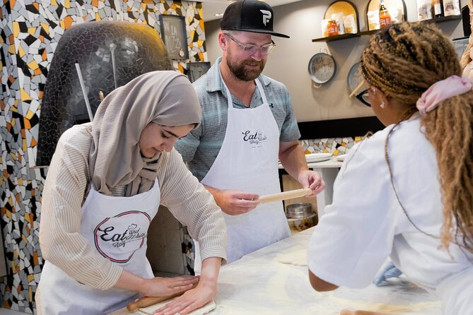 Cooking Class in the Heart of Rome: Pizza and Tiramisu Making - Enjoying your pizza and tiramisù, with wine and limoncello