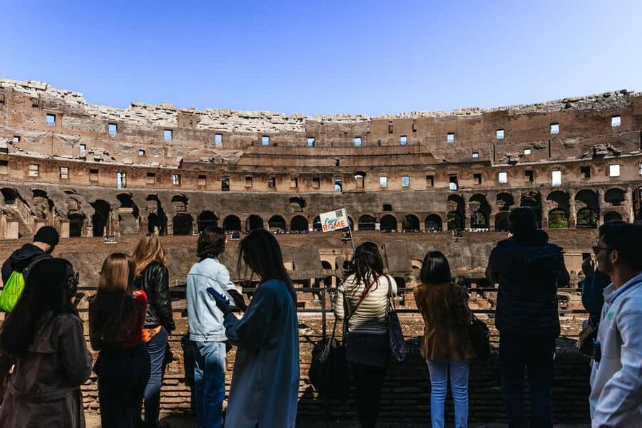 Rome: Colosseum, Forum & Palatine Hill Tour & Optional Arena - Entering the Colosseum and walking toward gladiator-level views