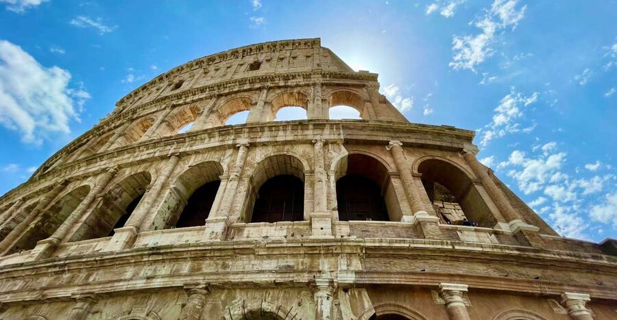 Rome: Colosseum Guided Tour with Entry Tickets - Inside the arena corridors: emperor box, social class seating, and building logic