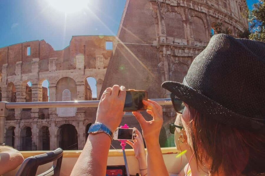 Rome: Colosseum, Roman Forum, Palatine Hill & Hop-on Hop-off - Entering the Colosseum complex, with the Forum and Palatine Hill as your payoff