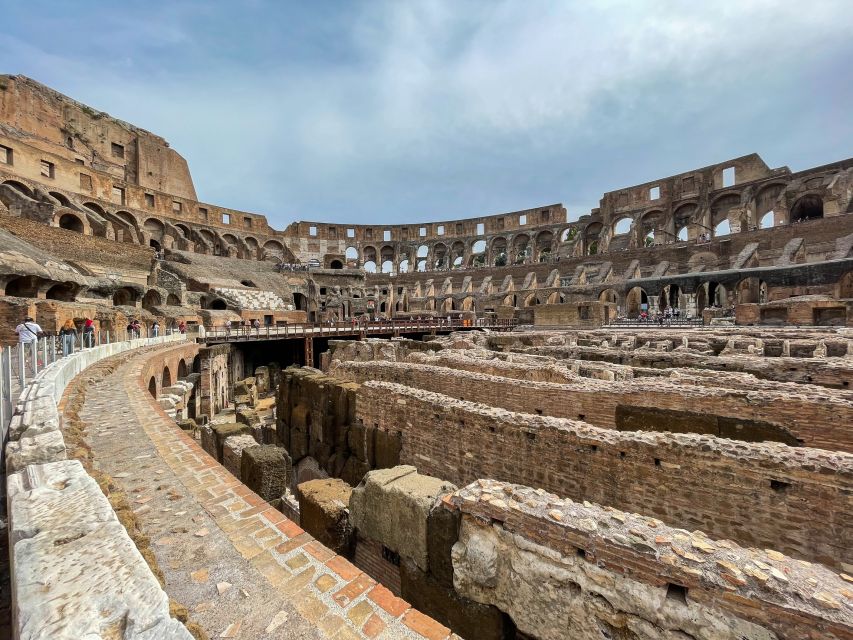 Rome: Colosseum Tour with Access to the Gladiator Arena - The arena floor walk: Libitina gate, where animals and gear moved