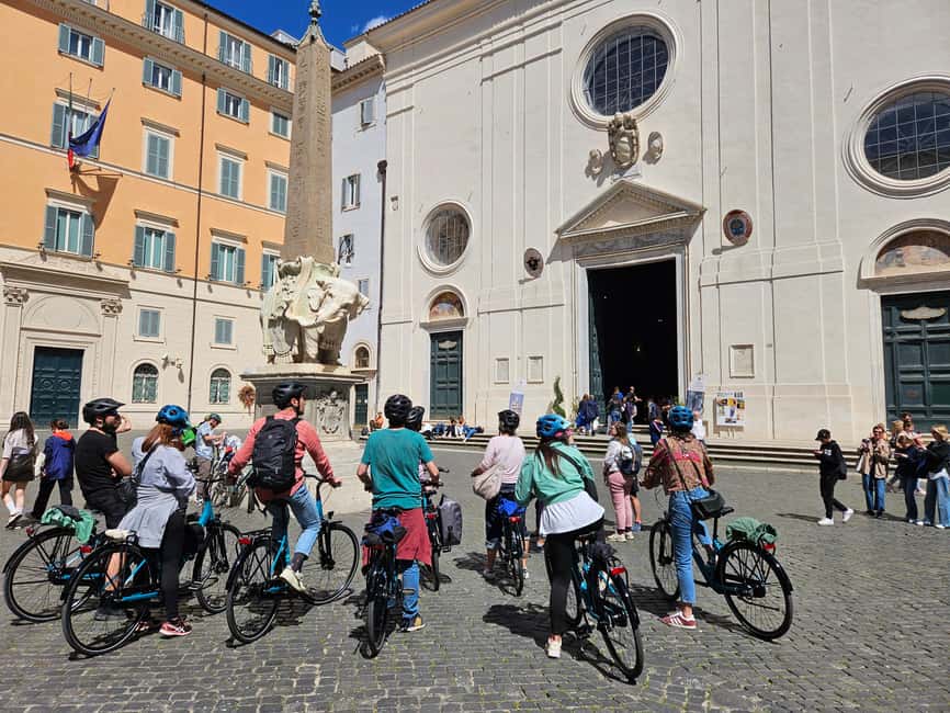 Rome E-Bike Tour with a local! (and a traditional snack) - Weather plan built in, with poncho and helmets